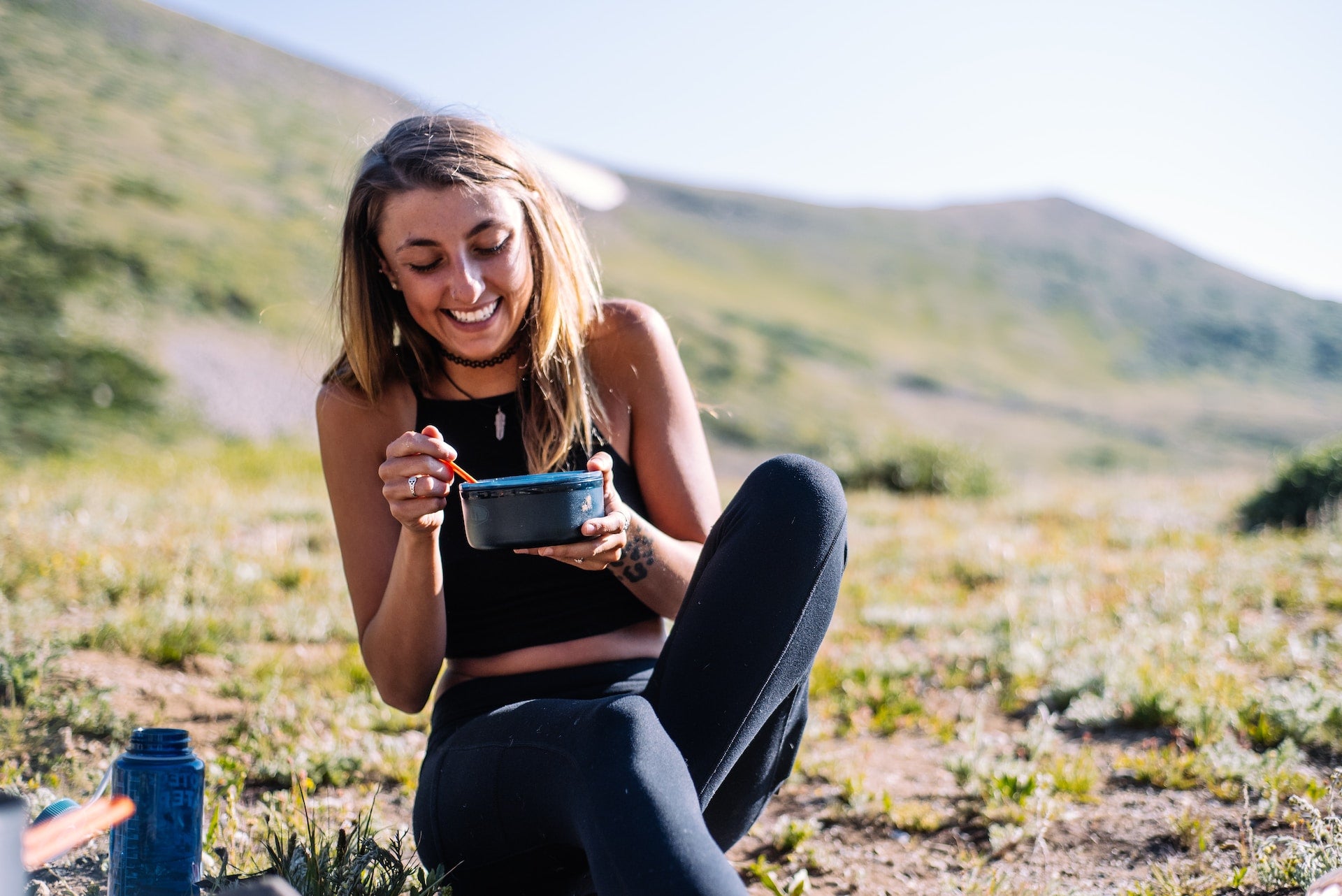 Woman preparing overnight oats with rolled oats, mixed nuts, and seeds for a high-protein, no-added-sugar breakfast—ideal healthy recipe for athletes, fitness, and active living.